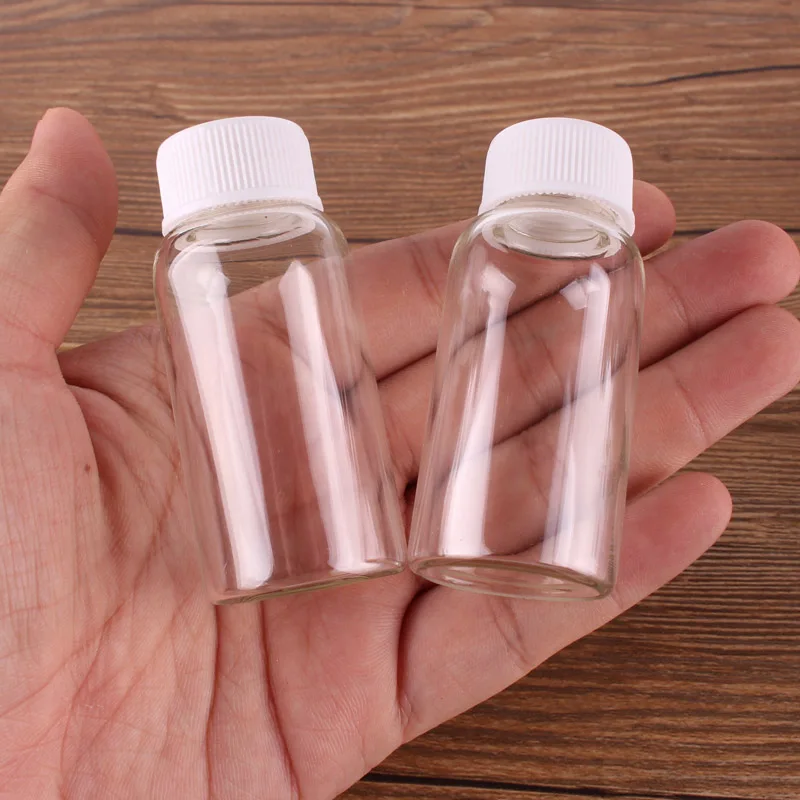 

24pcs 27*58mm 20ml Transparent Glass perfume Spice Bottles Container with White Plastic Screw lid Tiny Jar Vials DIY Craft