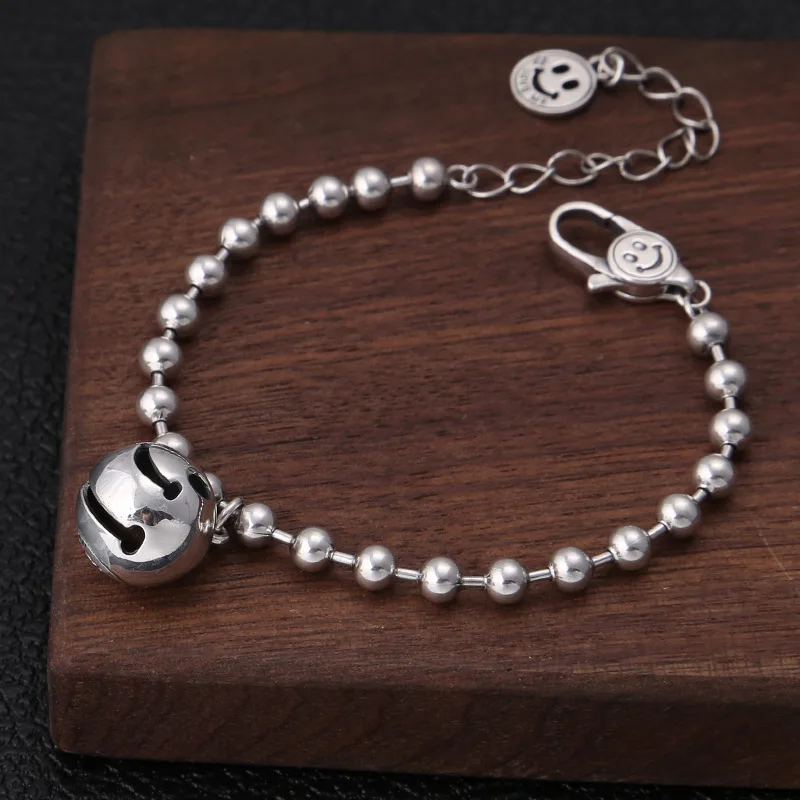 

S925 silver fashion accessories Han edition fashion Thai silver bells round bead smiling face joker female money bracelet