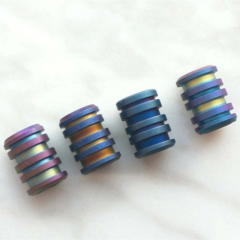 

Hot sale EDC Long Style Titanium Alloy Knife Beads Cylinder Paracord Outdoor Accessories Umbrella Rope Lanyard Pendant
