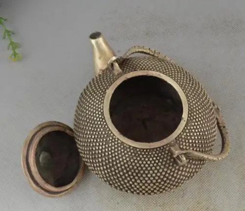 

Chinese Tibet Silver carved Beautiful Leisurely Teapot statue