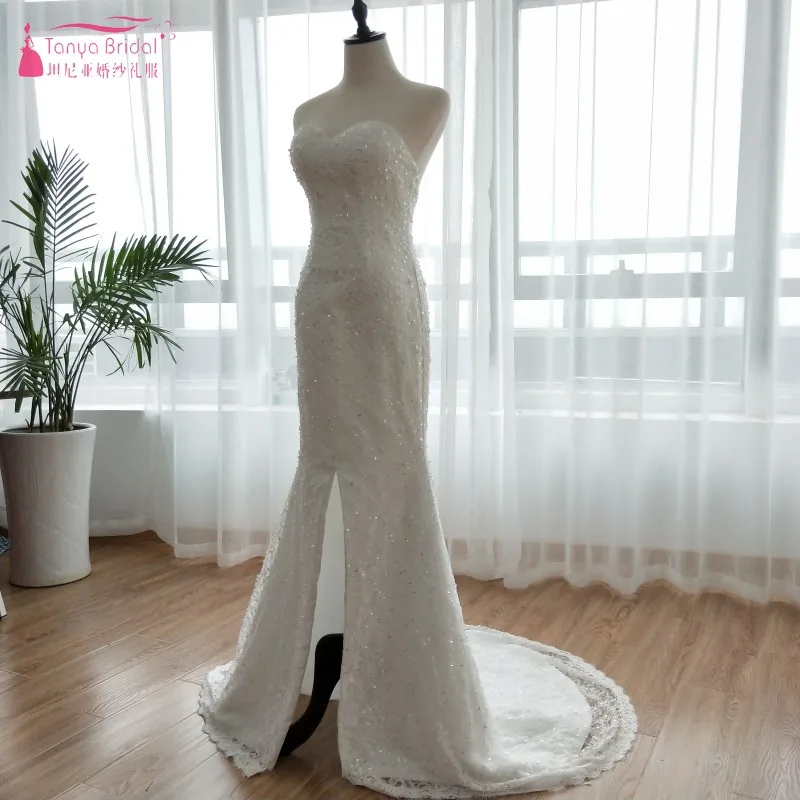 Роскошное свадебное платье цвета слоновой кости с отстегивающимися юбками