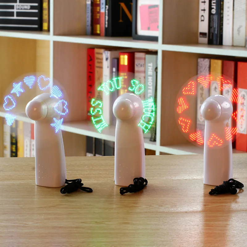 

Sarmocare Handheld Cooling Mini Fan Colorful Light Battery Power With Strap Self-programming Creative LED Messages Display