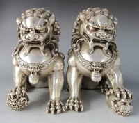 a pair of elaborate chinese tibetan silver guardian lion foo fu dog statues
