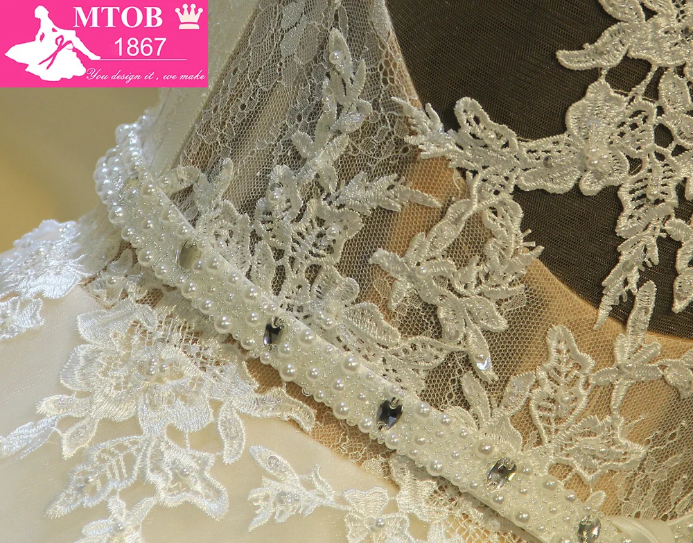 Кружевное свадебное платье трапециевидной формы романтичное без спинки