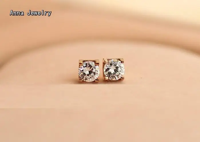 Серьги-гвоздики с одним ослепительным камнем в металлическом цвете цвета