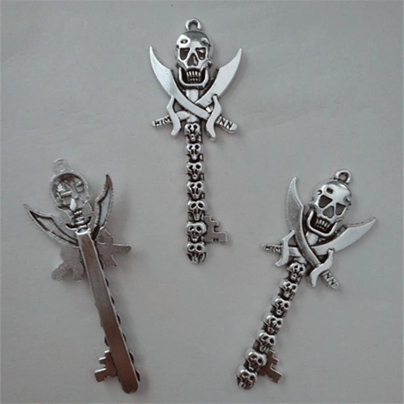 

RONGQING 50pcs/lot Cross Knife Skull Key Charms 23x60mm Protection Devil Charms Key Pendant Necklace Accessories Hand Made