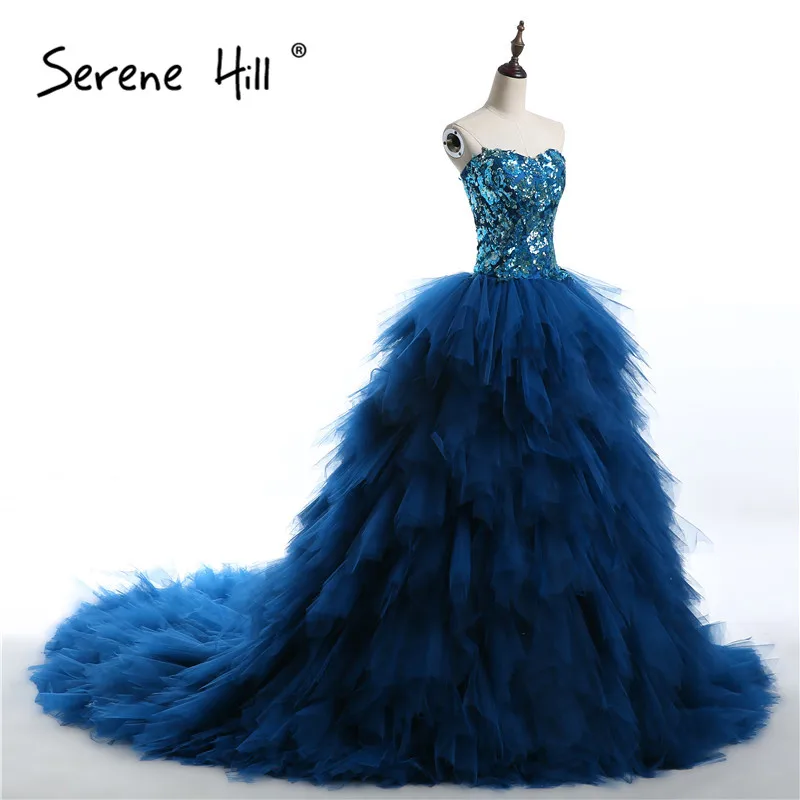 Роскошные вечерние платья с блестками модель 2020 года без рукавов оборками