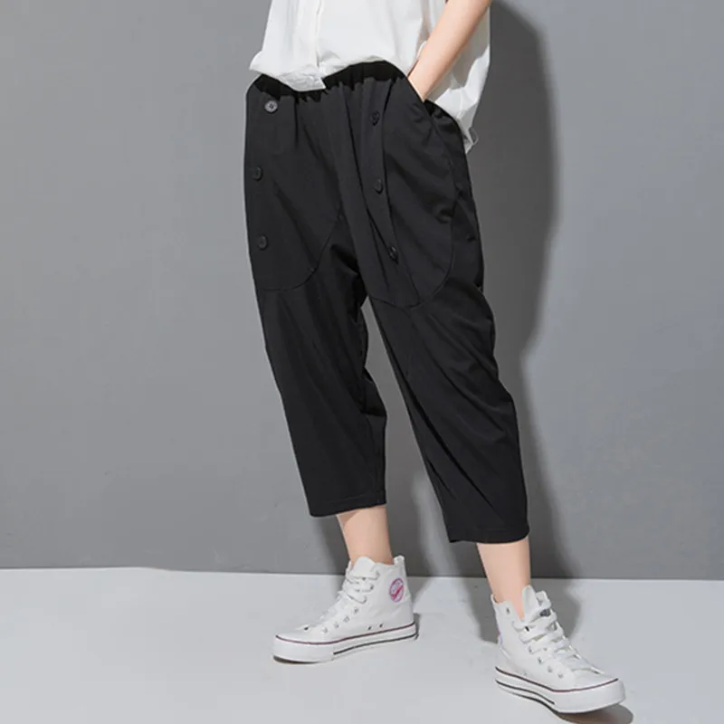 Женские свободные брюки асимметричного кроя повседневные на пуговицах с