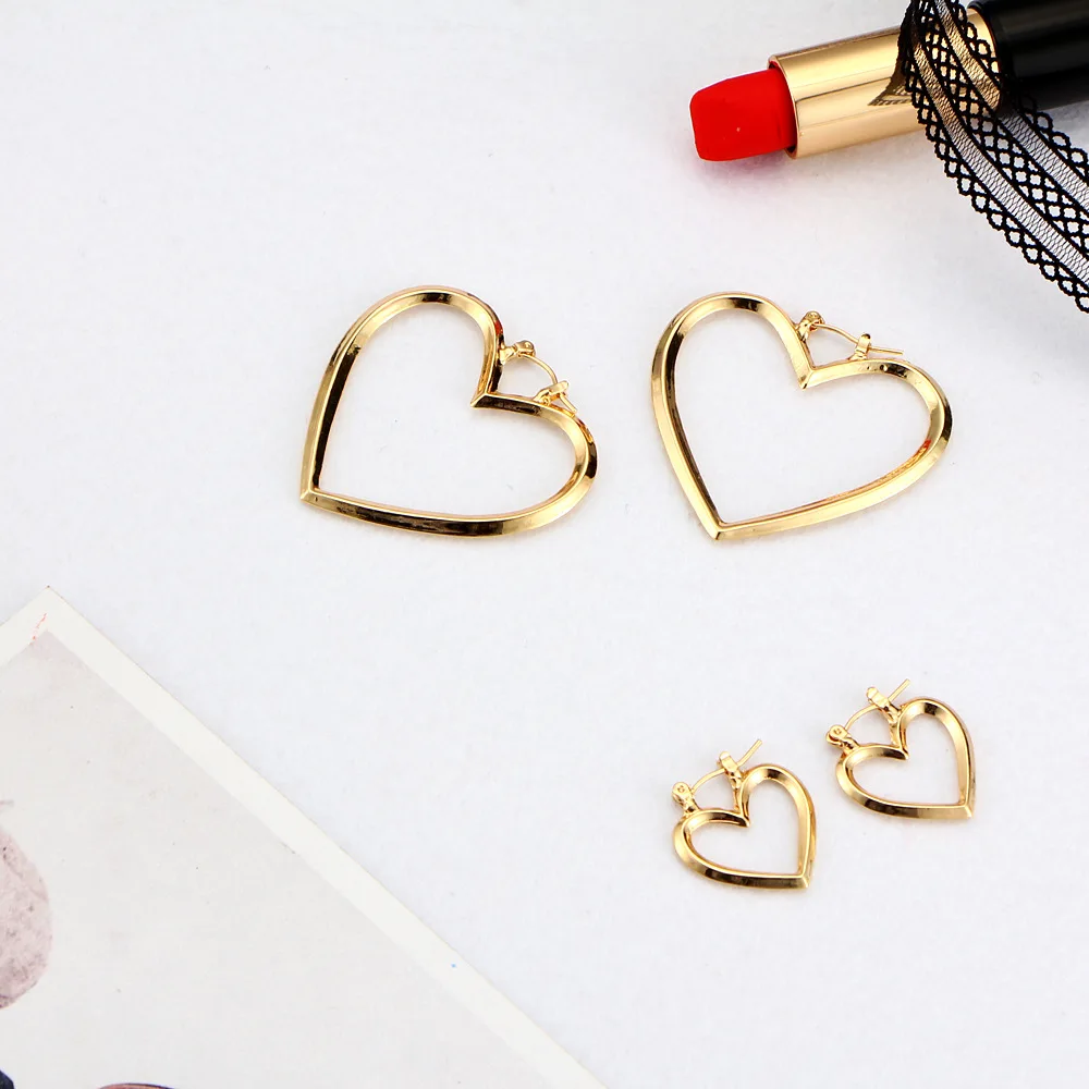 Женские серьги подвески с сердечками золотого и серебряного цвета длинные