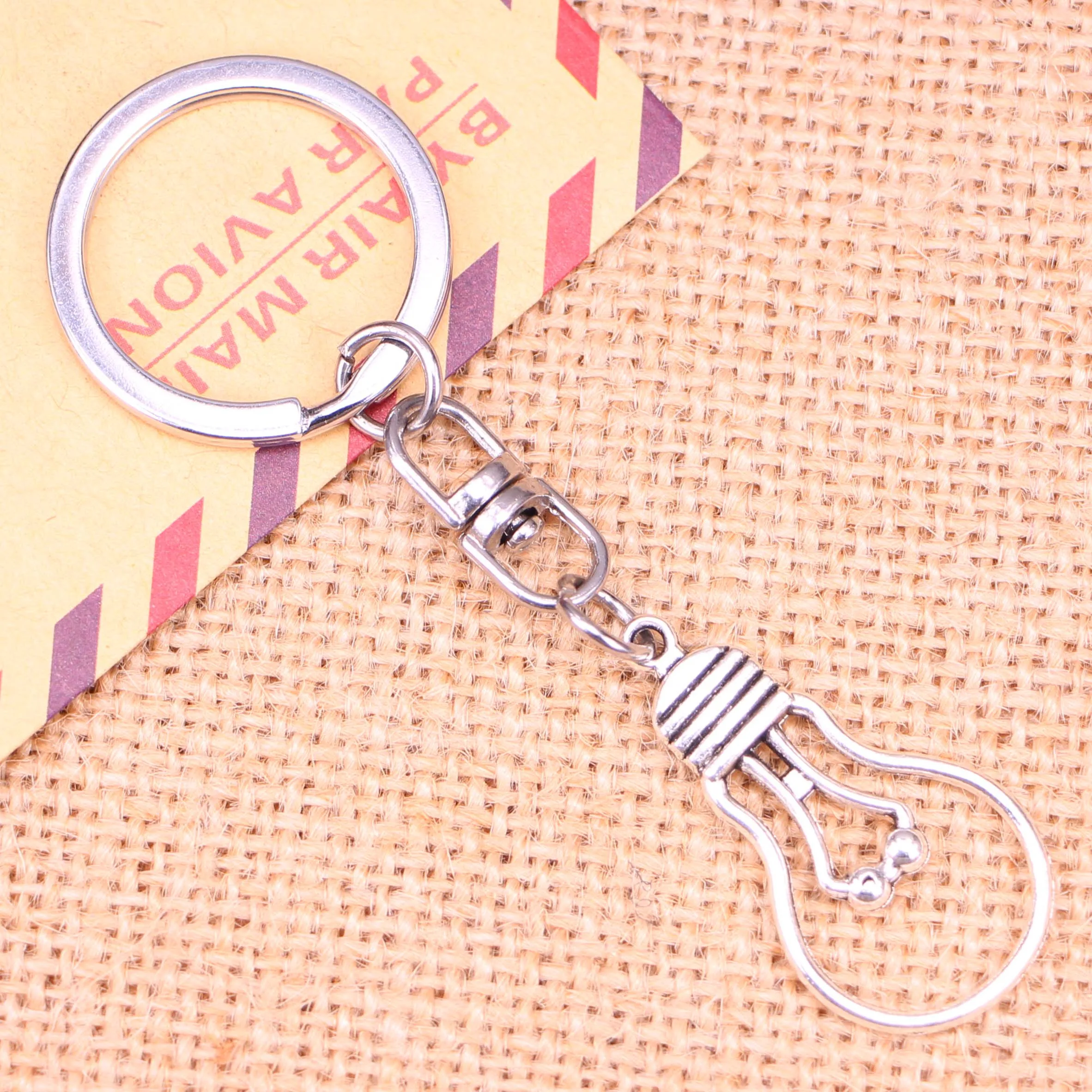 

20pcs New Fashion Keychain 19*35 mm light bulb Pendants DIY Men Jewelry Car Key Chain Ring Holder Souvenir For Gift