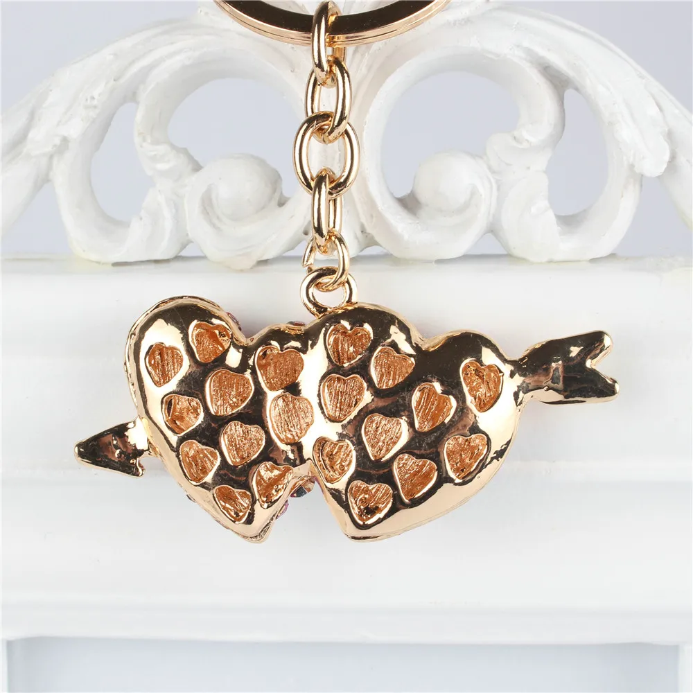 Сумка-кошелек с подвеской в виде стрелы и сердца украшенная кристаллами стразами