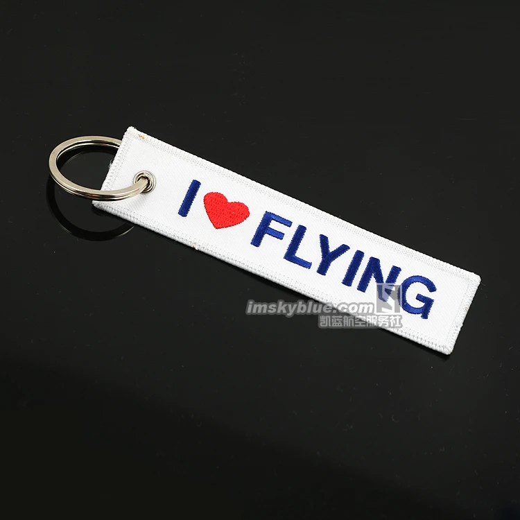 Багажная бирка I Love Flying для путешествий белая ткань с синей вышивальной сумкой