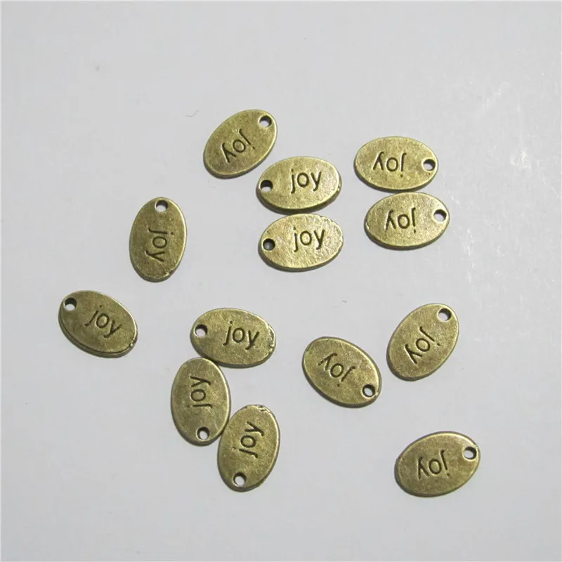 

RONGQING 50pcs/lot Antique Bronze Letter joy Charms Metal Alloy 14.4*9.5MM Oval Charms for DIY Jewelry Supplier Crafts