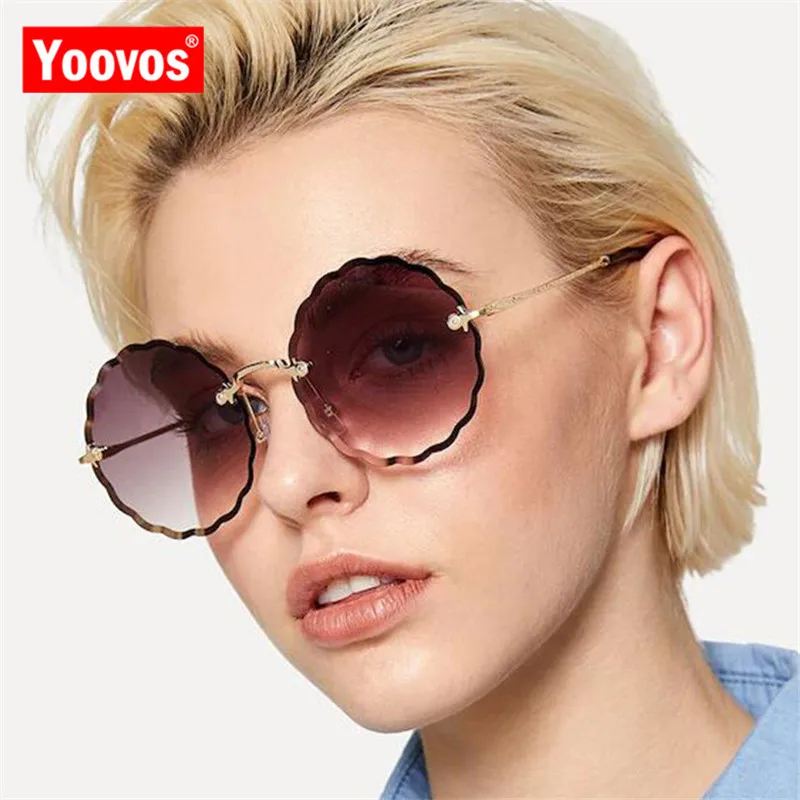 

Yoovos 2021 New Rimless Ocean Lens Sunglasses Women Brand Designer UV400 Classic Glasses Gafas Metal Goggle Eyewear For Women