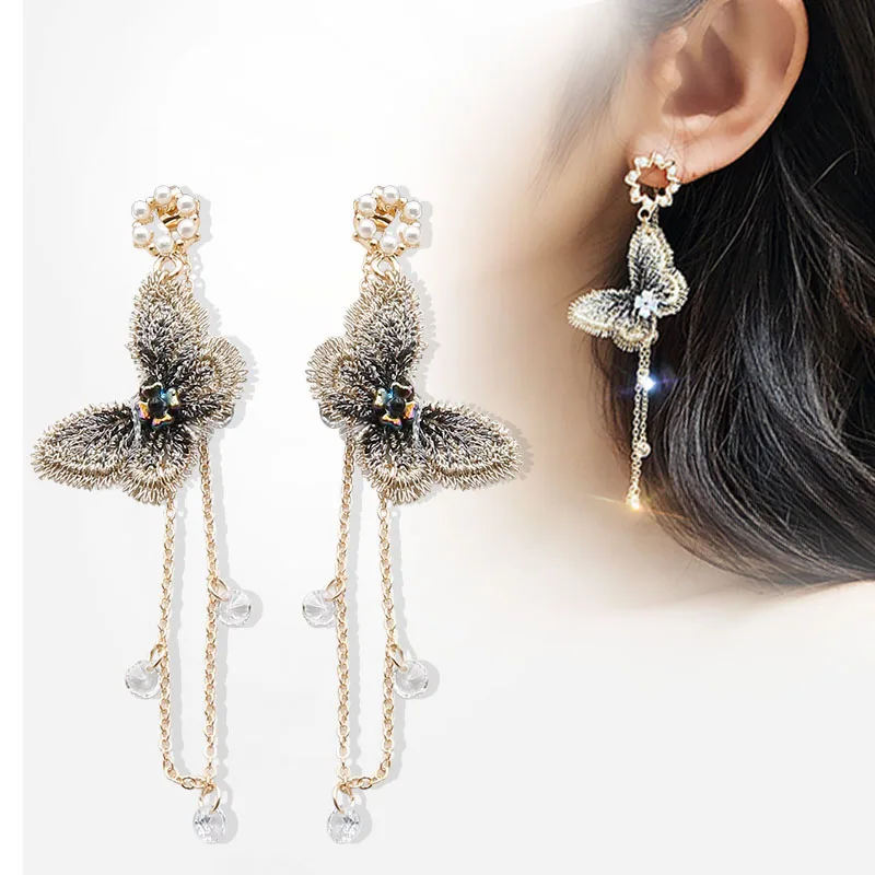 

New temperament butterfly earrings Pearl tide simple personality Europe and the United States Joker long earrings women