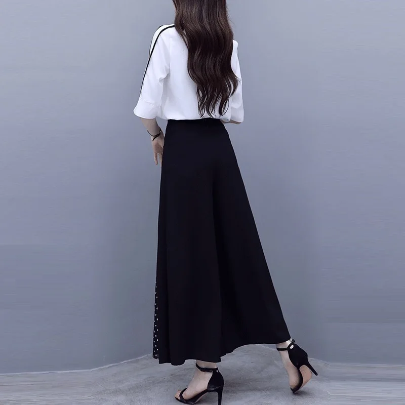 Женский комплект из двух предметов белая шифоновая блузка и широкие брюки костюм