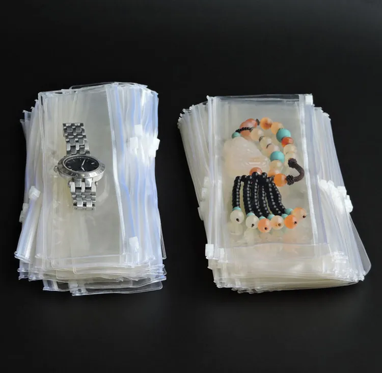Оптовая продажа 50 шт./лот толстых длинных прозрачных белых пластиковых PVC сумок для упаковки ювелирных изделий, предохраняющих от пыли и окисления, для хранения ожерелий и браслетов.