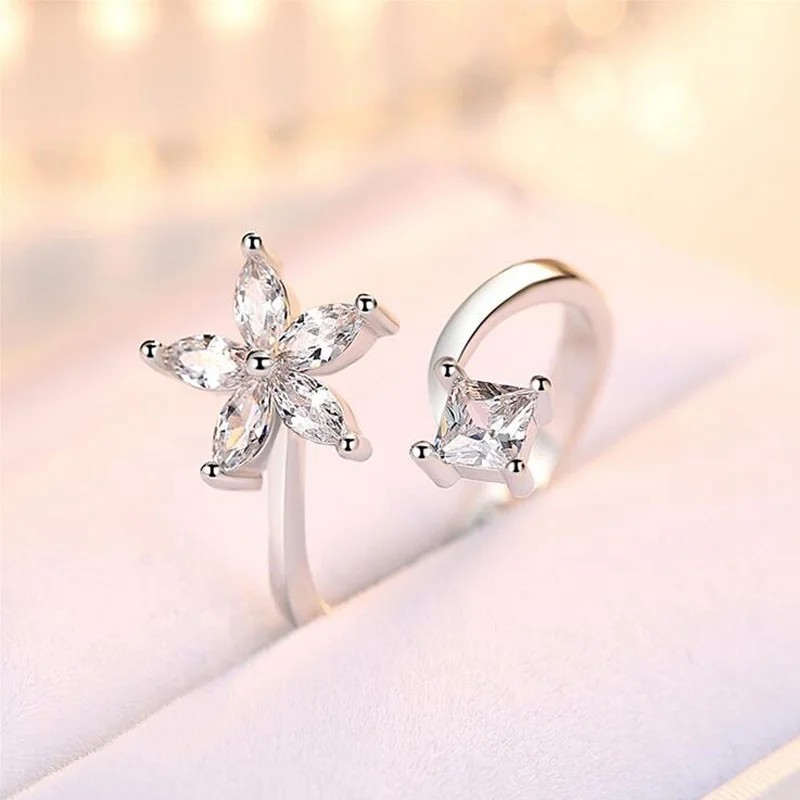 Женское кольцо с цветком и звездой простое Открытое из серебра 925 пробы белым