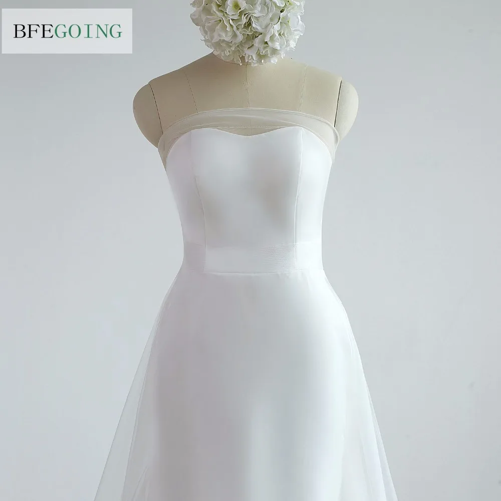 Свадебное платье из тюля цвета слоновой кости трапециевидной формы с длинным