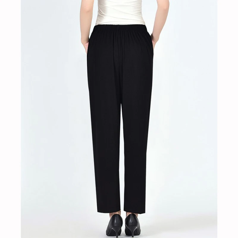 Женские брюки большого размера свободные эластичные средней длины на весну и