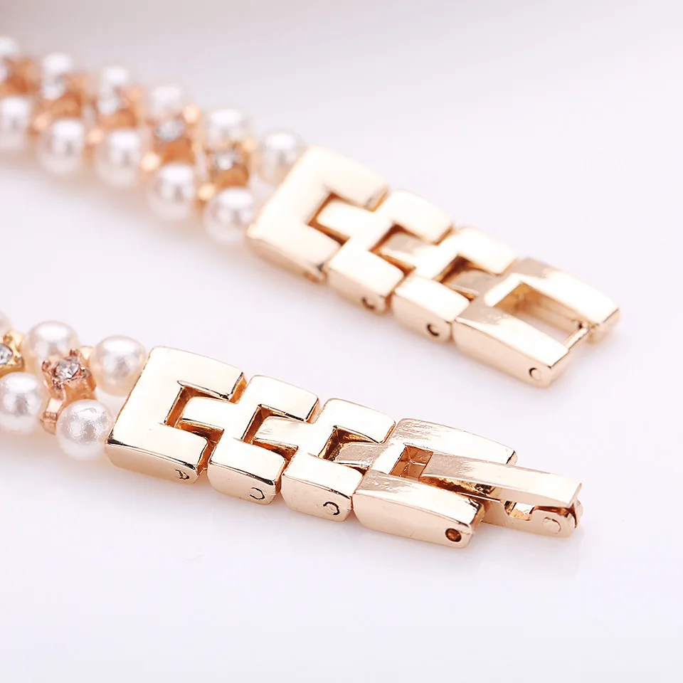 Роскошные часы-браслет из розового золота с жемчугом и стразами Женские