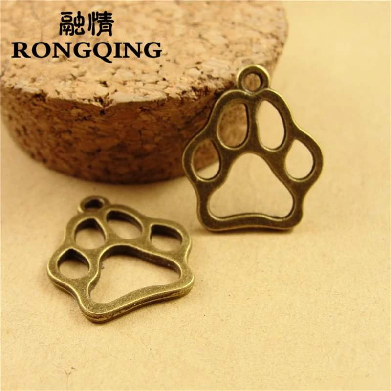 

RONGQING 100pcs/lot 19*16.5MM Dog Paw Footprint Antique Bronze Hollow Animal Foot Print Jewelry Charms