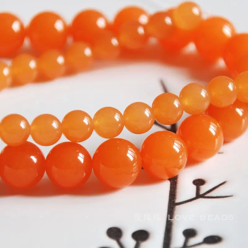 натуральные бусины коралл оранжевый 10мм. оранжевый камень в бусах. корал камень овал. бисер кошачий глаз. красно оранжевый камень.