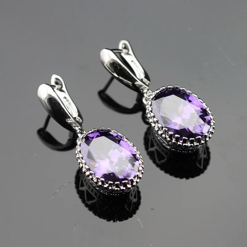 Женские серьги подвески серебряного цвета овальные с фиолетовым фианитом