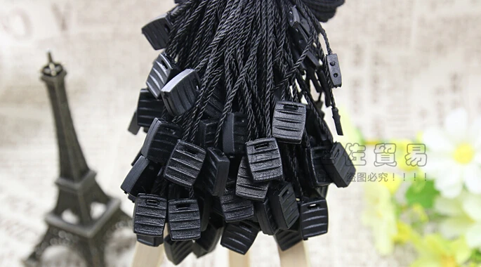 

in stock new arrival head Good quality plastic clothing tag string in apparel, hang tag strings cord for garment string seal tag
