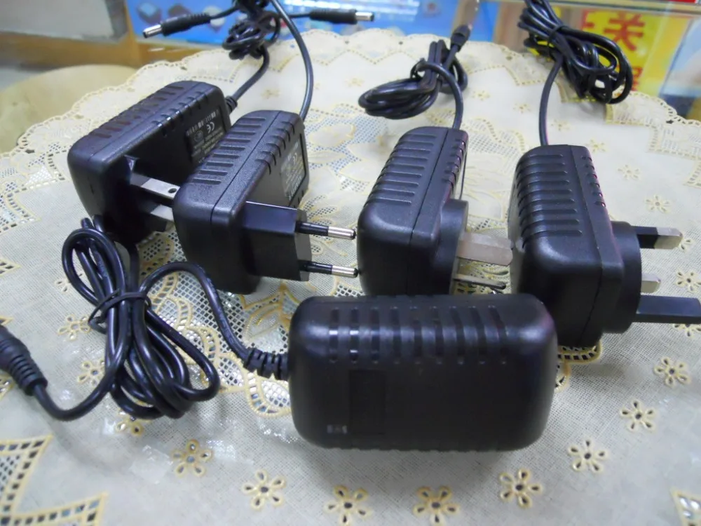 DC 12V 2A Блок питания адаптер безопасности профессионального преобразователя EU / US адаптер для светодиодных светильников бесплатная доставка на.