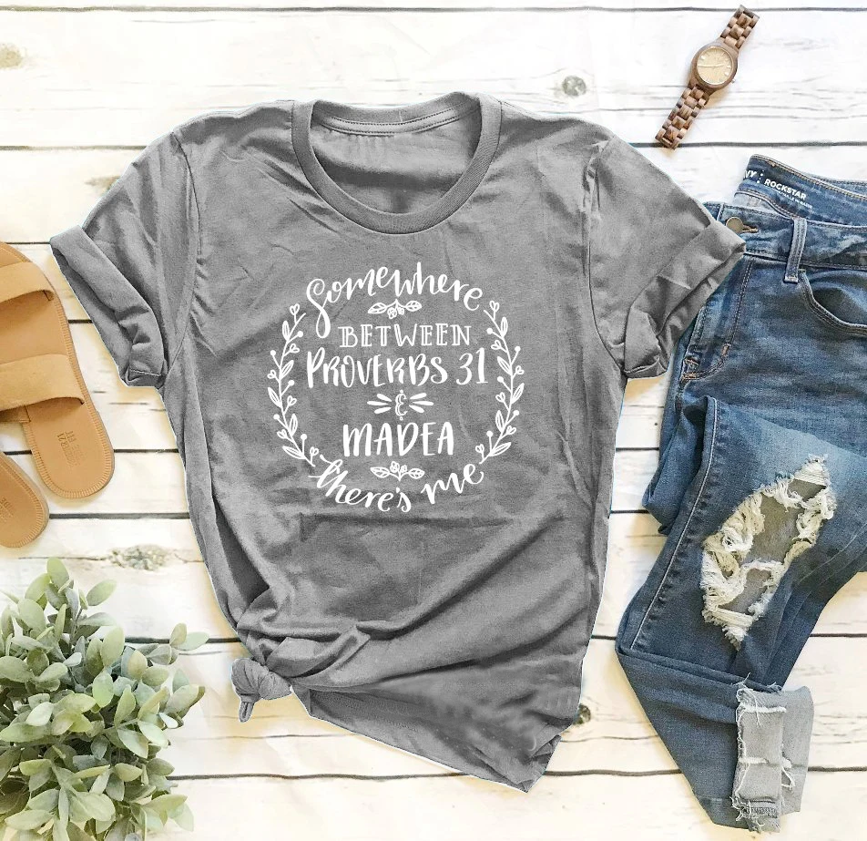 

Somewhere Between Proverbs 31 and Madea t-shirt slogan Christian Funny Mom Shirt aesthetic vintage 90s fashion tees cotton tops