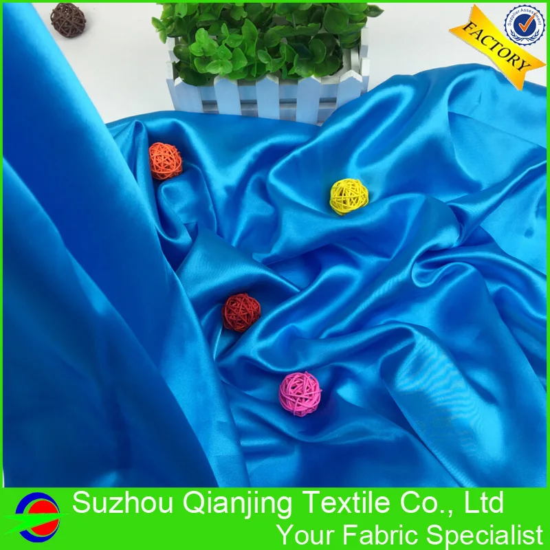 Блестящая гладкая мягкая кислота синяя полиэфирная атласная ткань высокого