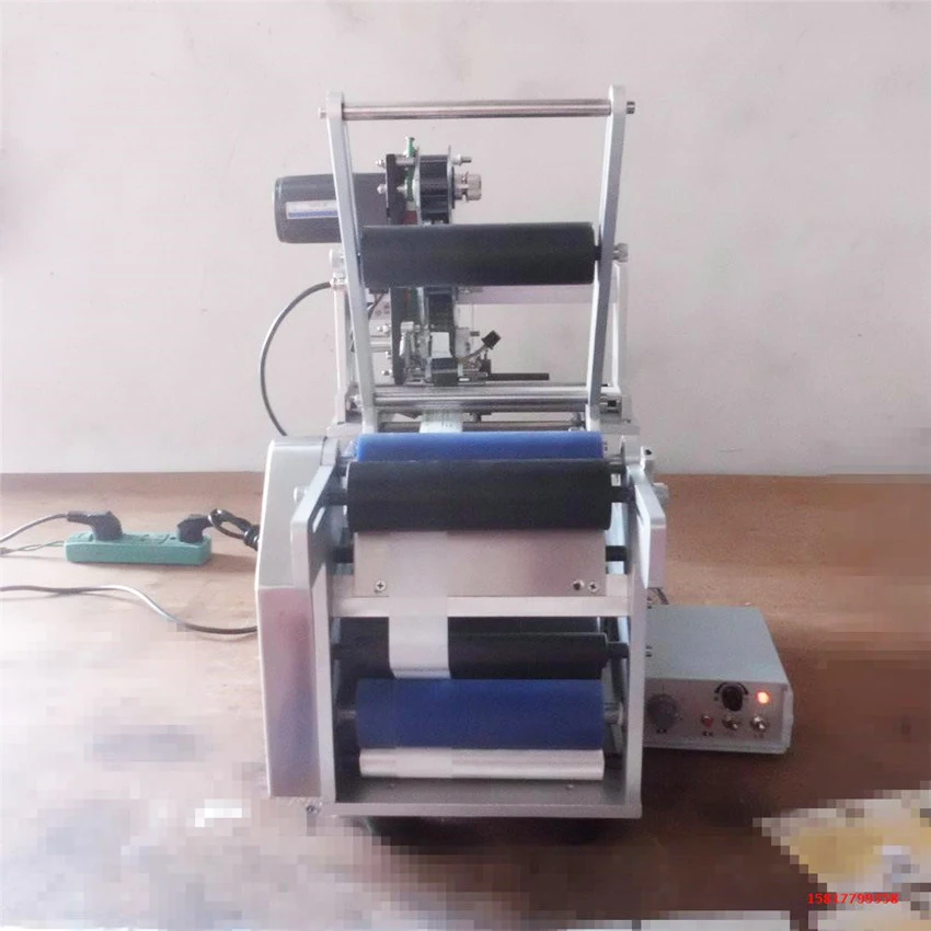 

Semi-automatic Round Bottle Labeling the labeler packing machine bottle labeling machine Workpiece diameter 10-150MM