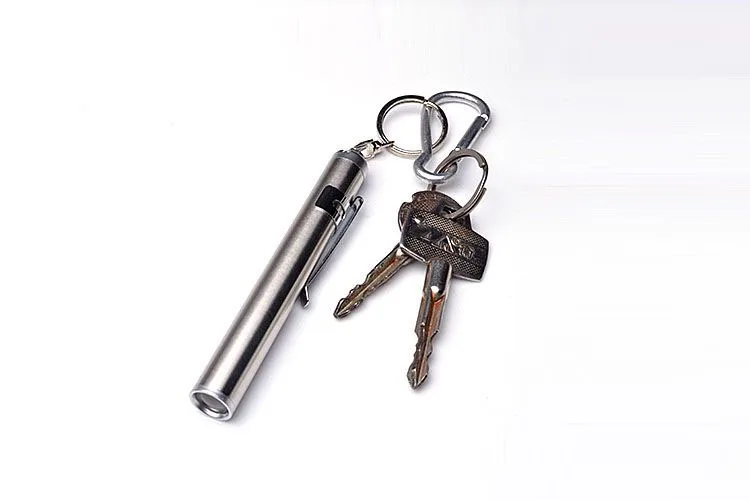 

Mini defense flashlight Stainless steel waterproof ultra small multifunction glare flashlight keychain home outdoor self defense