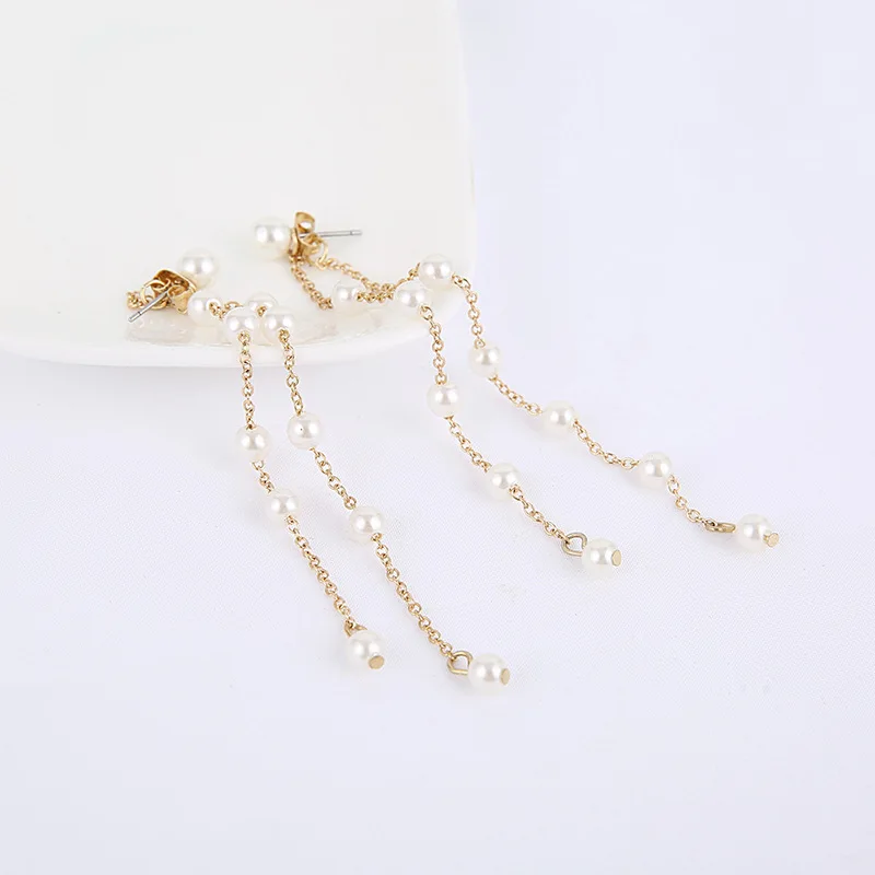 Женские двухрядные длинные серьги с кисточками выполненные вручную в