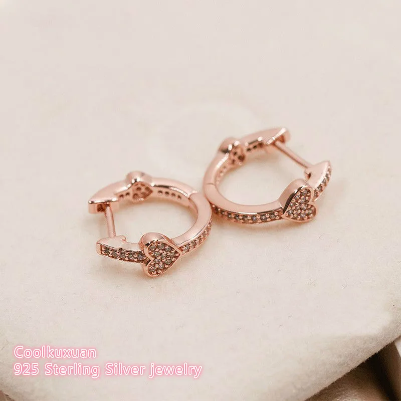 Осенние серьги "Манящие сердца" из 100% серебра 925 пробы с кристаллами цвета розового золота и прозрачными CZ камнями от оригинального европейского бренда ювелирных изделий.