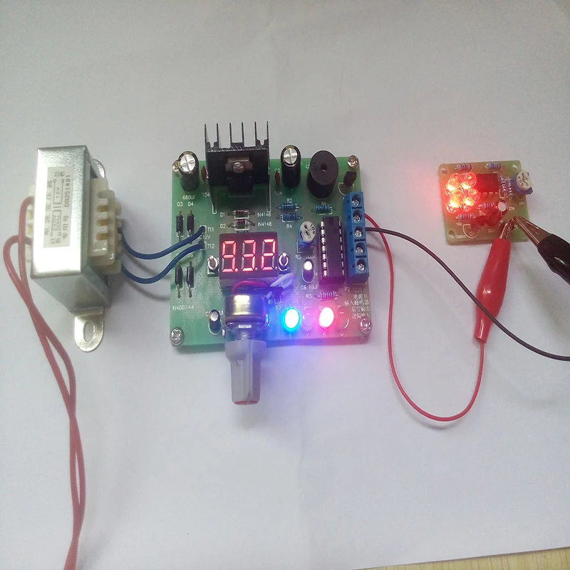 

2pcs/lot DIY Kit LM317 Adjustable Regulated Voltage 220V to 1.25V-12.5V Step-down Power Supply Module PCB Board Electronic kits