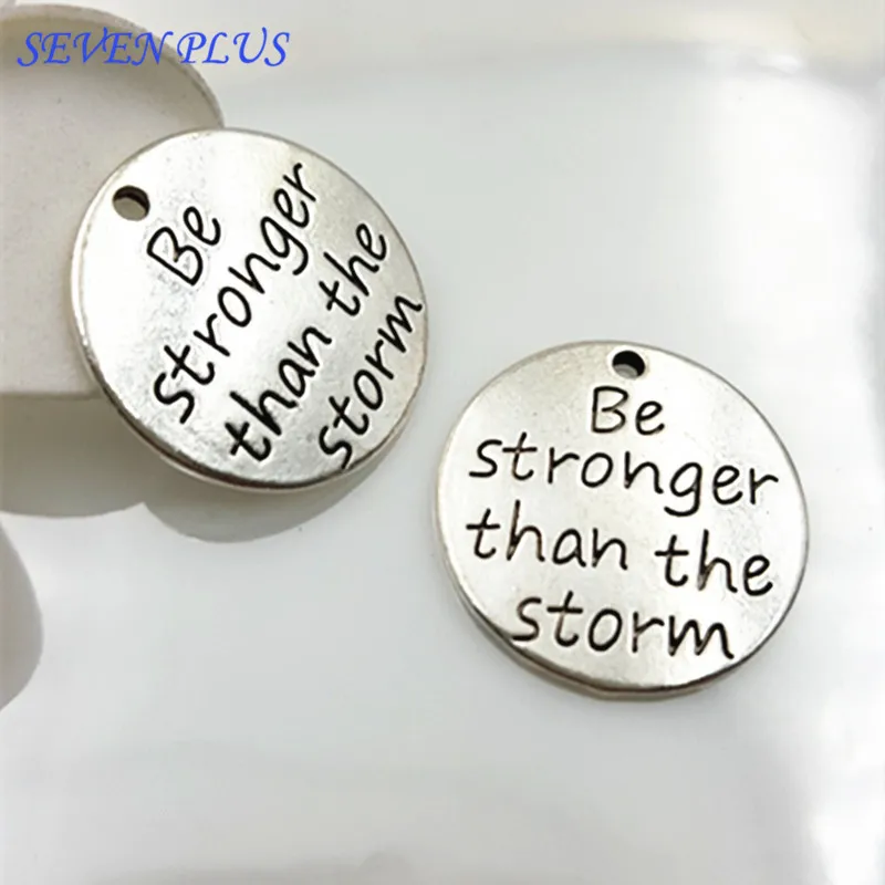 

Newest Style 20 Pieces/Lot Diameter 23mm Antique Silver Plated Be Stronger Than The Storm Message Charms For Jewelry Making