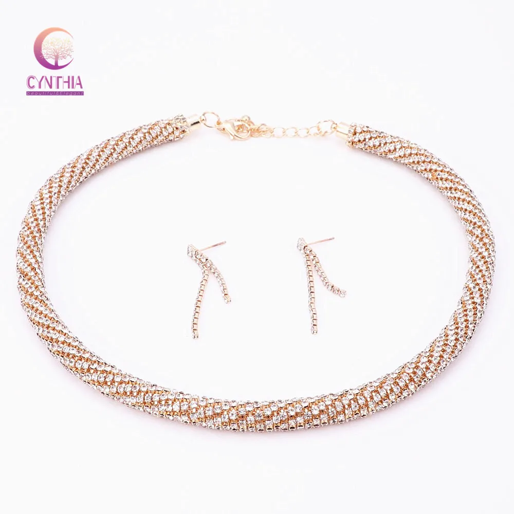 Роскошный женский ошейник золотого/серебряного цвета с черным пистолетом