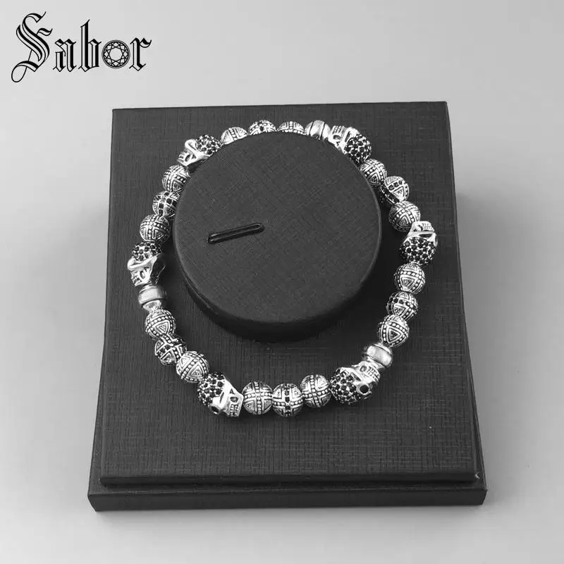 Мужской браслет с черепами и крестиками новинка почерненный серебристый цвет