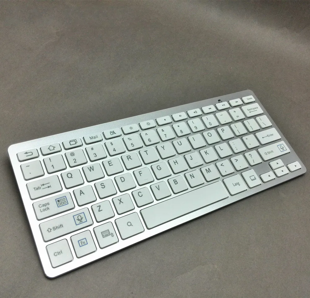 Ультратонкая модная Bluetooth клавиатура с поддержкой нескольких систем разных в