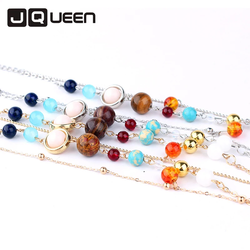 JQUEEN браслет из натуральных камней на запястье золотистого/серебристого цвета