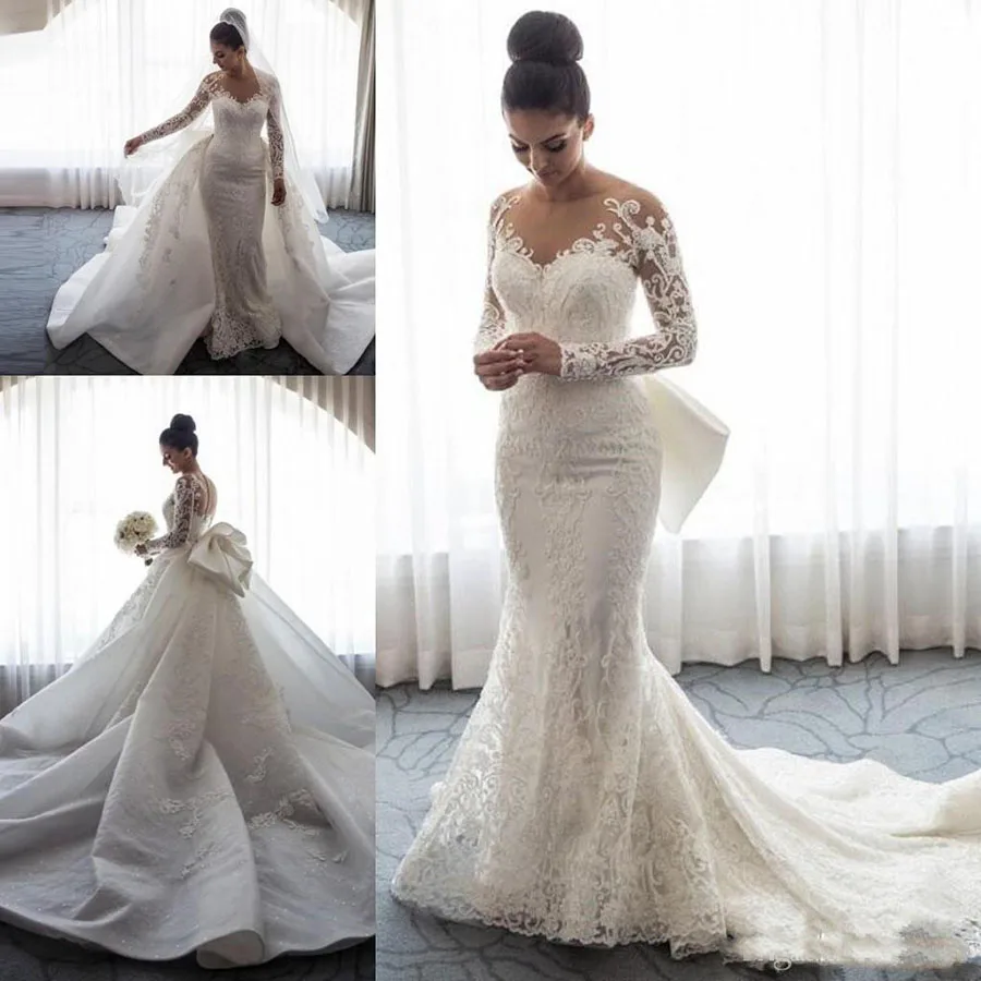 

2018 Luxury Mermaid Wedding Dresses Sheer Neck Long Sleeves Illusion Full Lace Applique Bow Overskirts Button Back Chapel Train