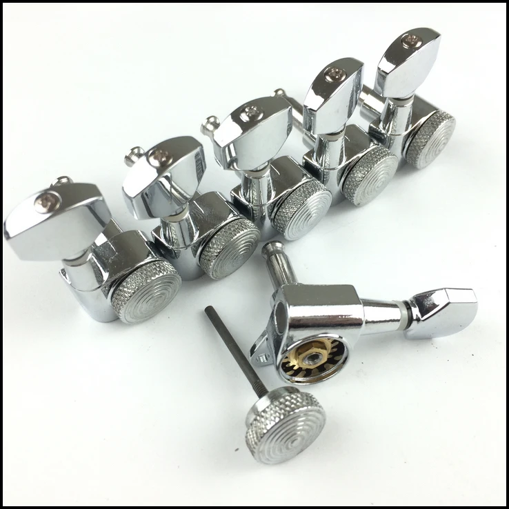 

Silver arm after being hand locking tuners guitar strings guitar string head lock button