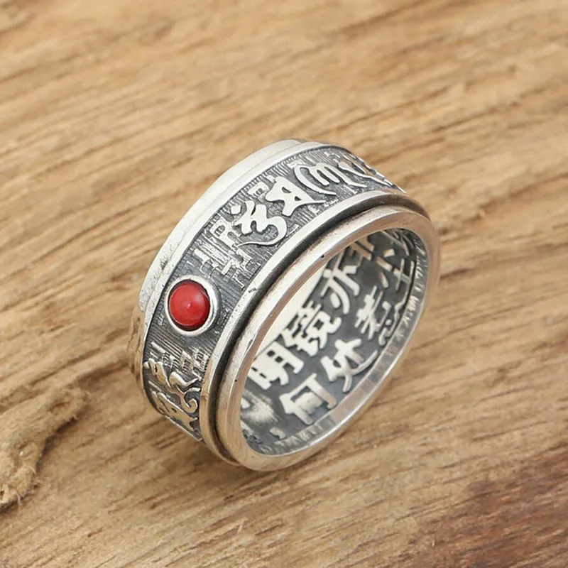 Свадебное кольцо с красным драгоценным камнем вращающееся на 100% градусов в форме