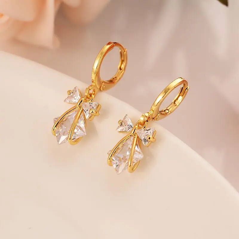 Набор ювелирных изделий серьги с бантом и белым кристаллом из кубического