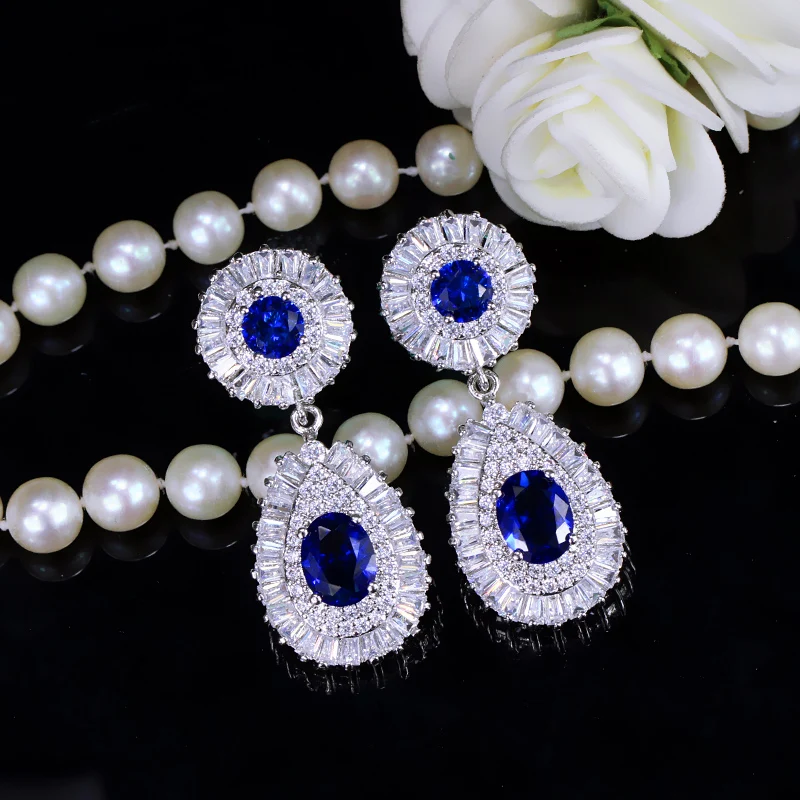 Женские длинные серьги подвески CWWZircons с синими камнями модель CZ314|earrings with blue stone|all