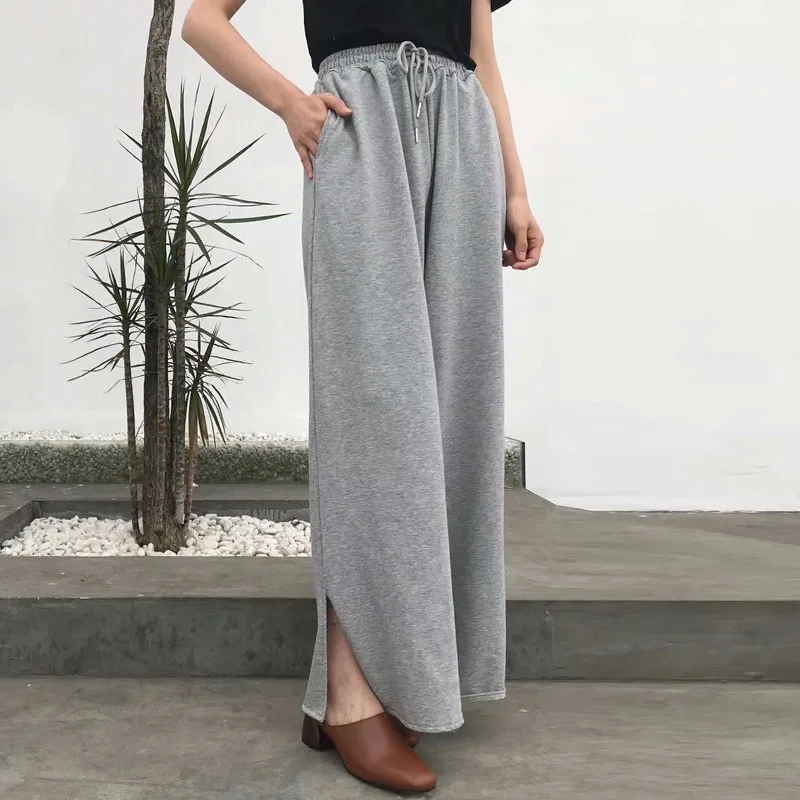 Женские брюки с разрезом TWOTWINSTYLE эластичные высокой талией и карманами на