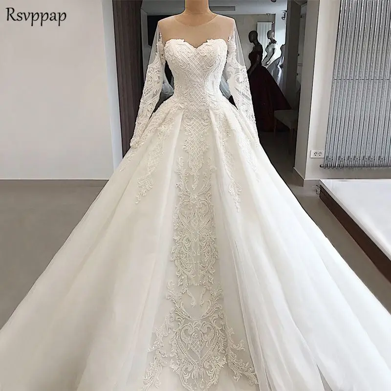 

Elegant Lace Wedding Gowns 2020 Sheer Long Sleeve A-line Nude Back Pearls White Tulle Arabic Wedding Dresses
