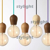 modern bright sprout wood pendant lamp a fixture design by jonas hoejgaard multi clolor cord and wood cap pendant lighting
